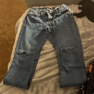 Skinny mid rise jeans no signs of flaws .